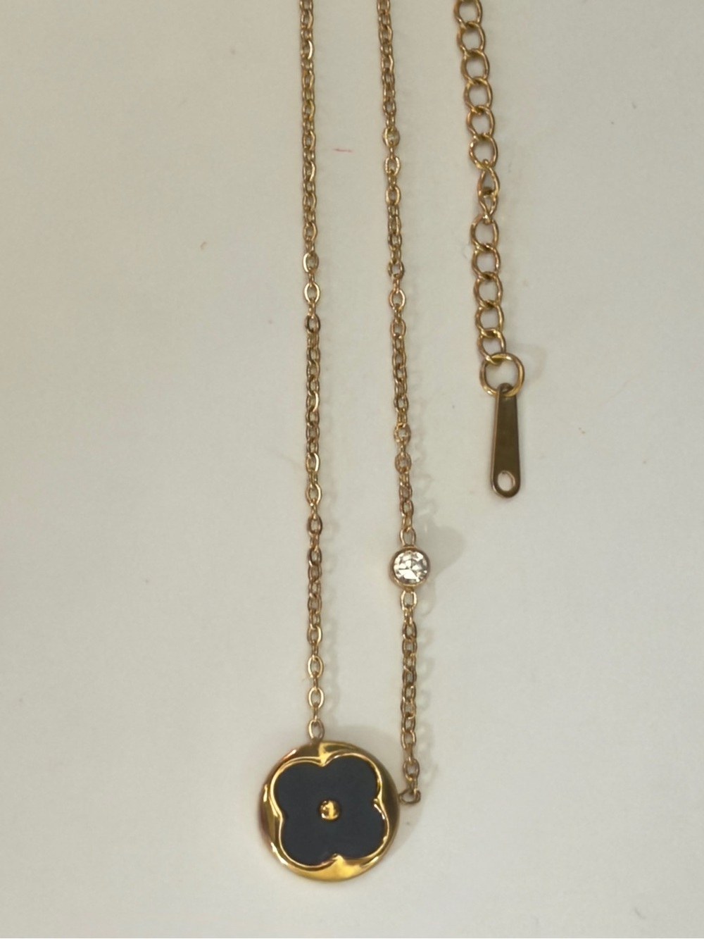 Gold Necklace with Black Clover Pendant